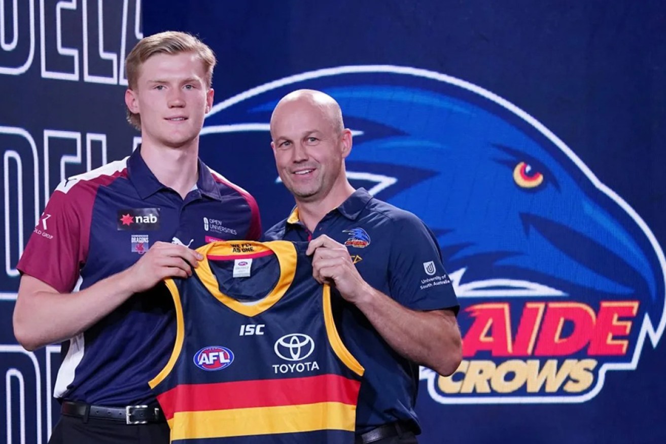 Fischer McAsey with Crows coach Matthew Nicks at the 2019 AFL draft. McAsey is leaving football after a three year career. Photo: Michael Dodge/AAP