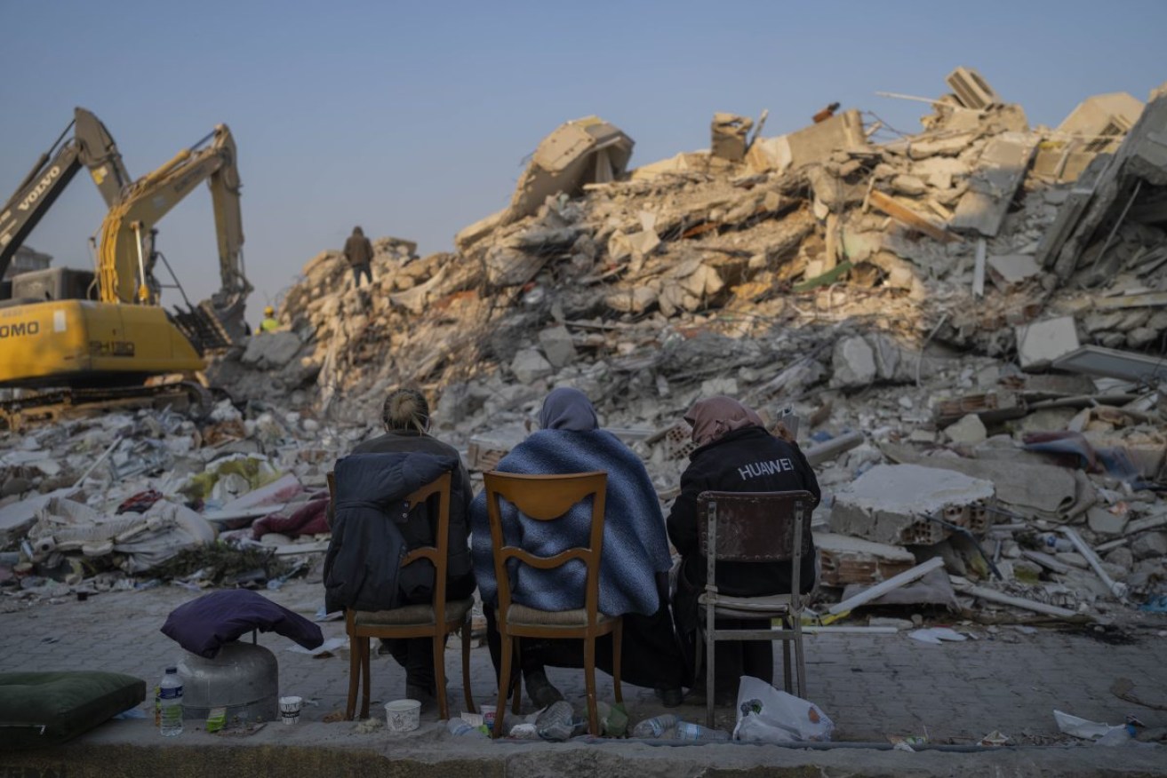 Survivors among the rubble in Antakya, Turkey. Photo: AP/Bernat Armangue