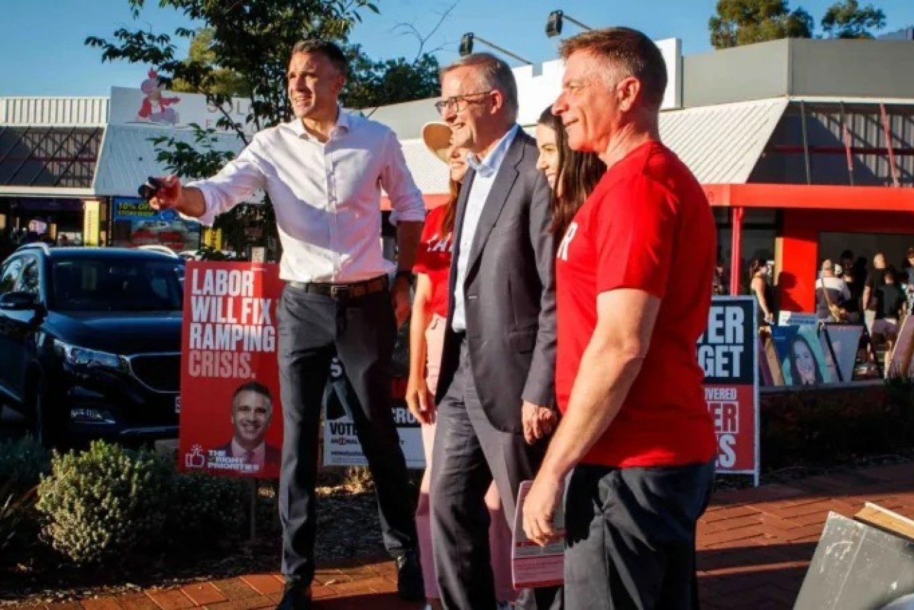 Peter Malinauskas with now Prime Minister Anthony Albanese and Labor candidates during a visit to a pre-polling booth ahead of the 2022 state election. Photo: Matt Turner/AAP