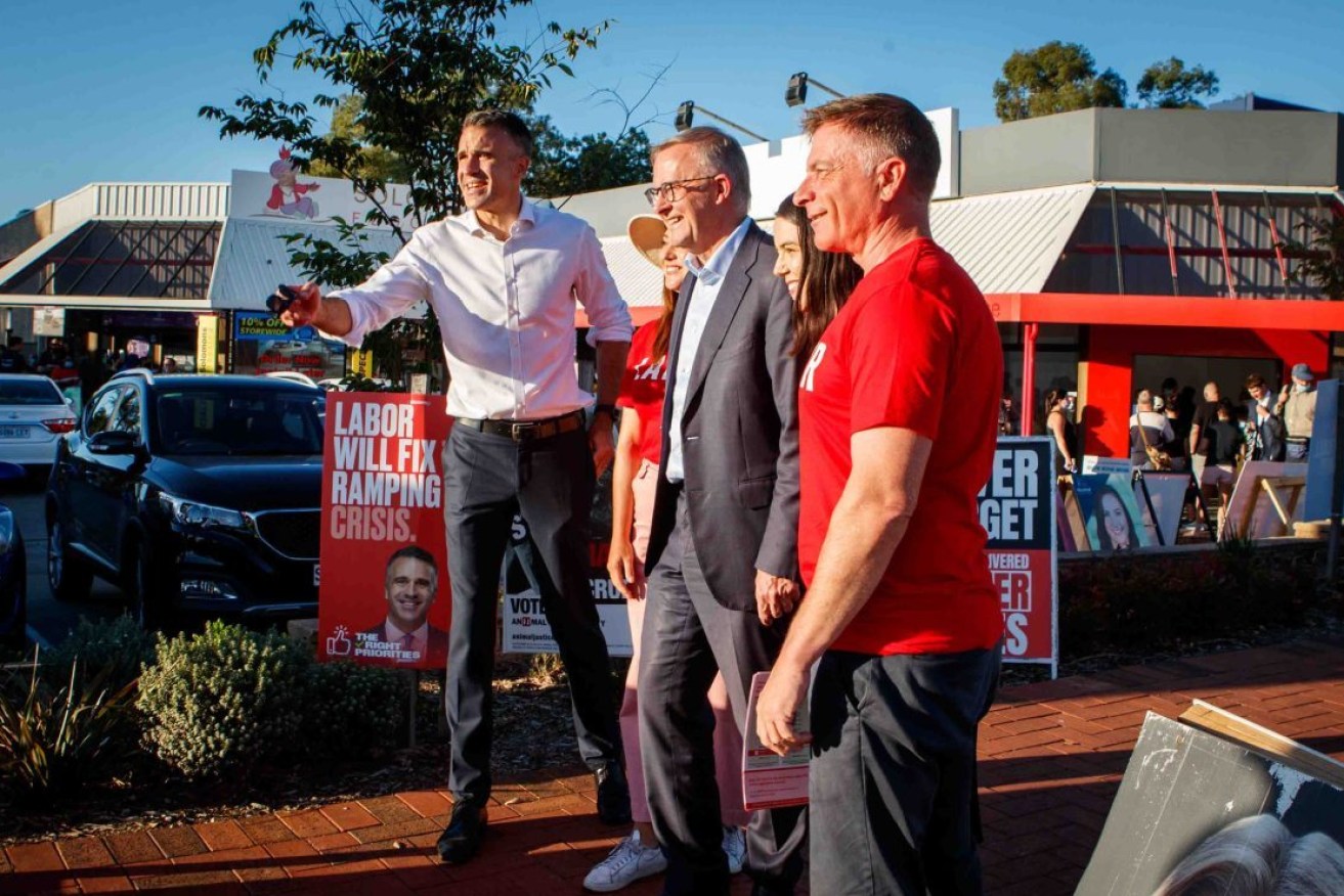 Peter Malinauskas with now Prime Minister Anthony Albanese and Labor candidates during a visit to a pre-polling booth ahead of last year's election. He's literally standing by his promise. Photo: AAP/Matt Turner