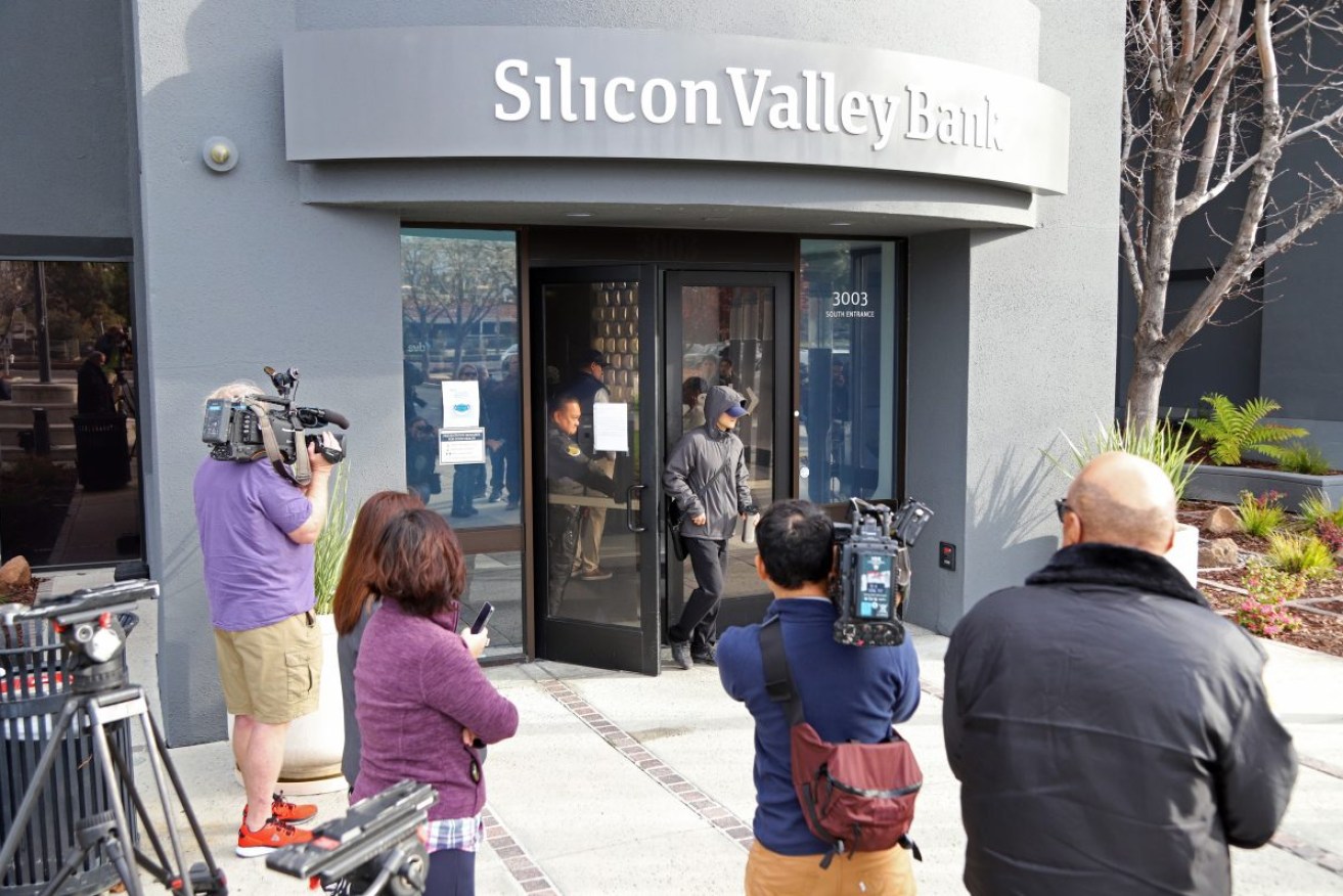 A customer leaves the headquarters of Silicon Valley Bank. The Federal Deposit Insurance Corporation took control of the bank's assets, making it the largest bank to do so since the 2008 finical crisis. Photo: EPA/GEORGE NIKITIN