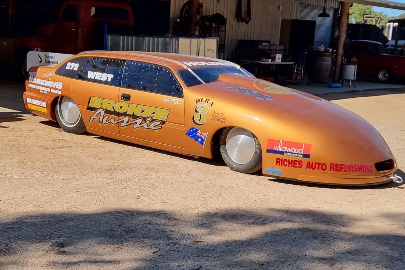 This modified VR Commodore is bidding to break the Australian land speed record for a piston driven car at Lake Gairdner in South Australia's north. Photo: AAP/Supplied