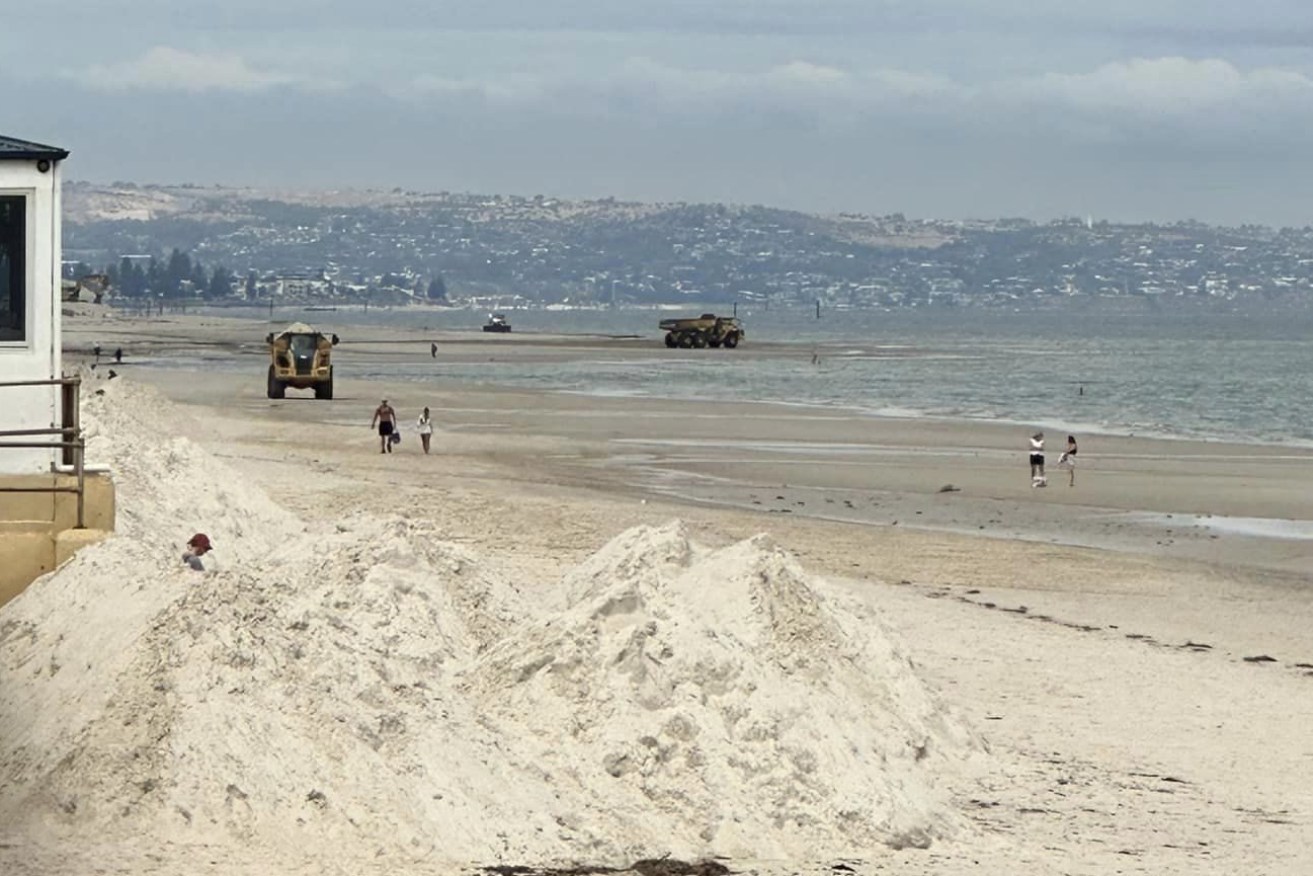 Trucks are dumping sand onto Henley Beach but locals say it is already washing away. Photo: Save West Beach Sand/Facebook