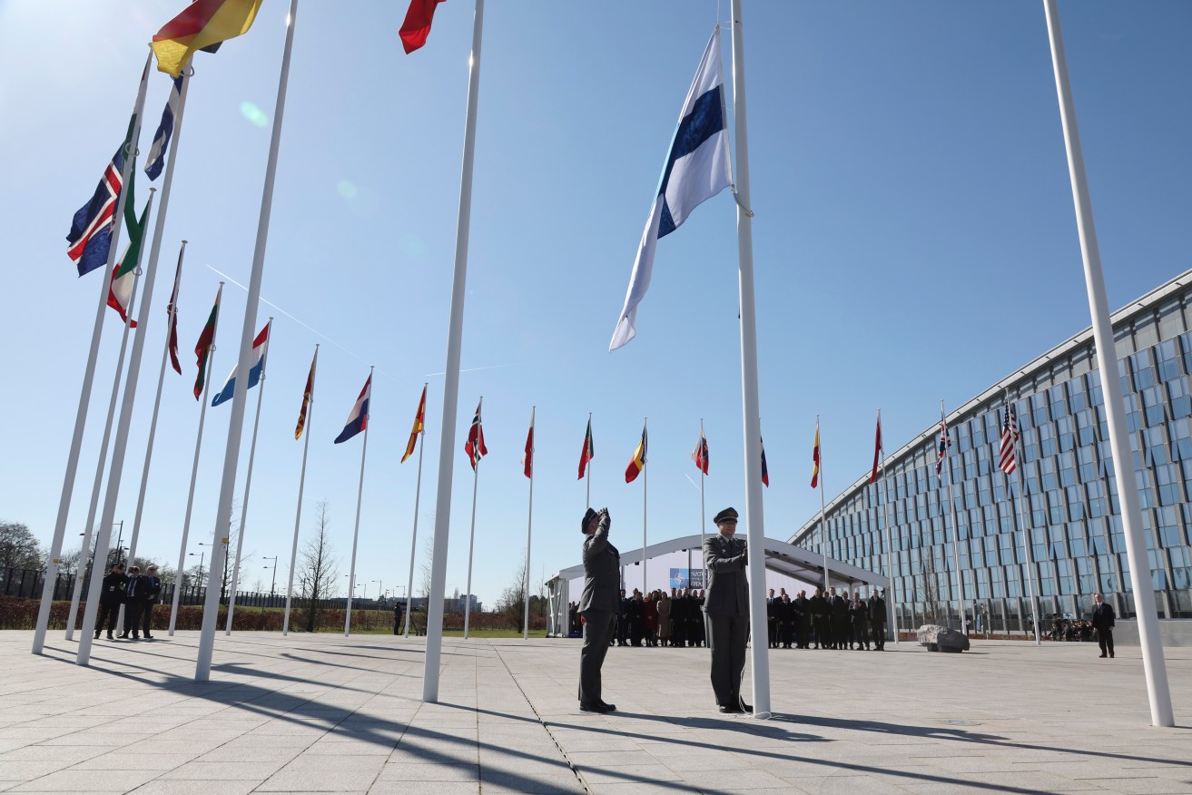 Finland's flag is raised outside NATO headquarters in Brussels. Photo: AP/Geert Vanden Wijngaert