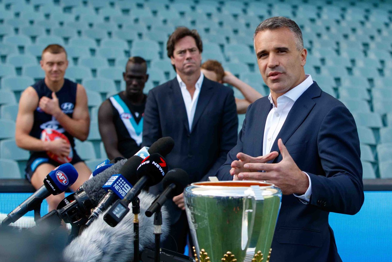 South Australian Premier Peter Malinauskas launching the AFL's Gather Round - an event which will almost certainly increase COVID infections. Photo: AAP/Matt Turner