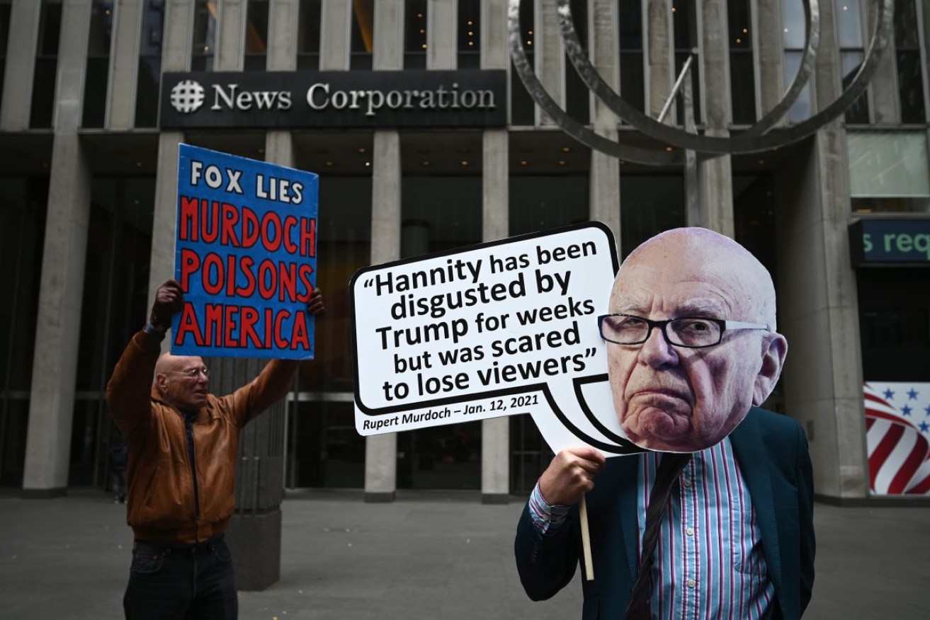 Protesters outsides News Corp's New York office before Fox agreed to pay $1.2 billion to avoid a defamation trial. Photo: Anthony Behar/Sipa USA