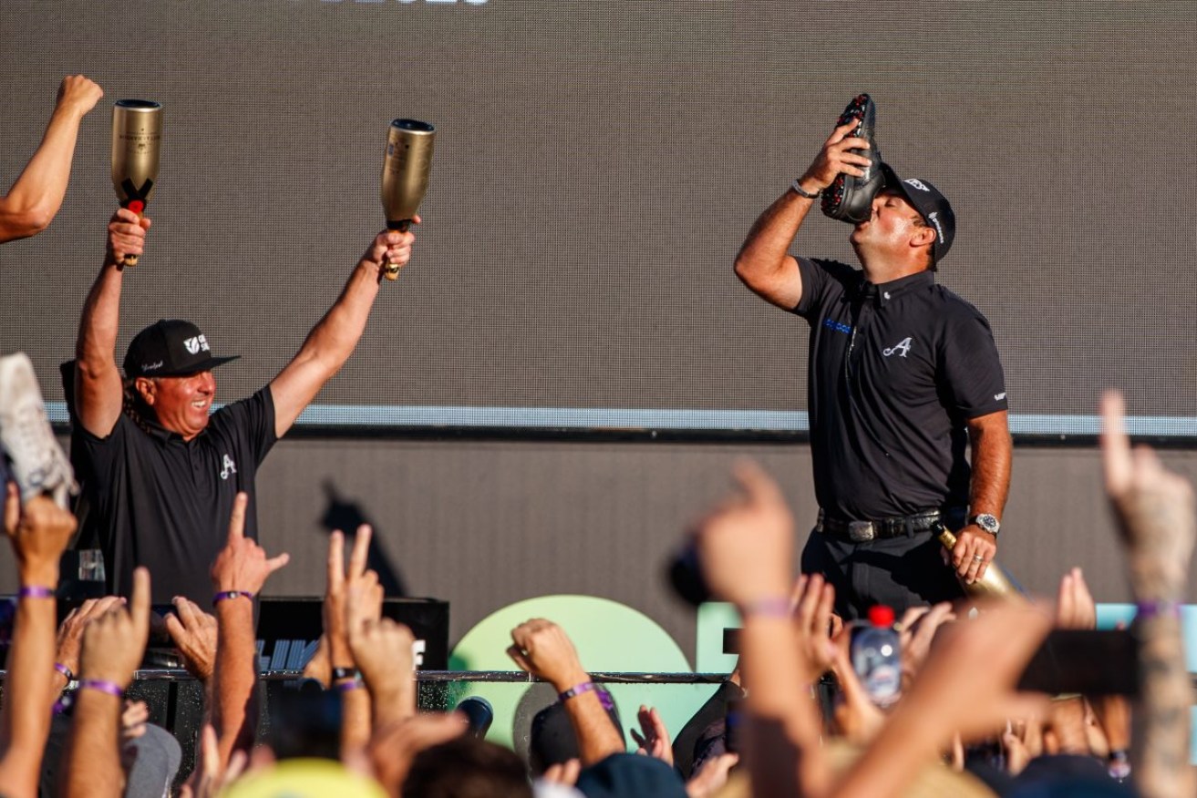 Patrick Reed does a shoey to celebrate victory during LIV Golf Adelaide. AAP/Matt Turner
