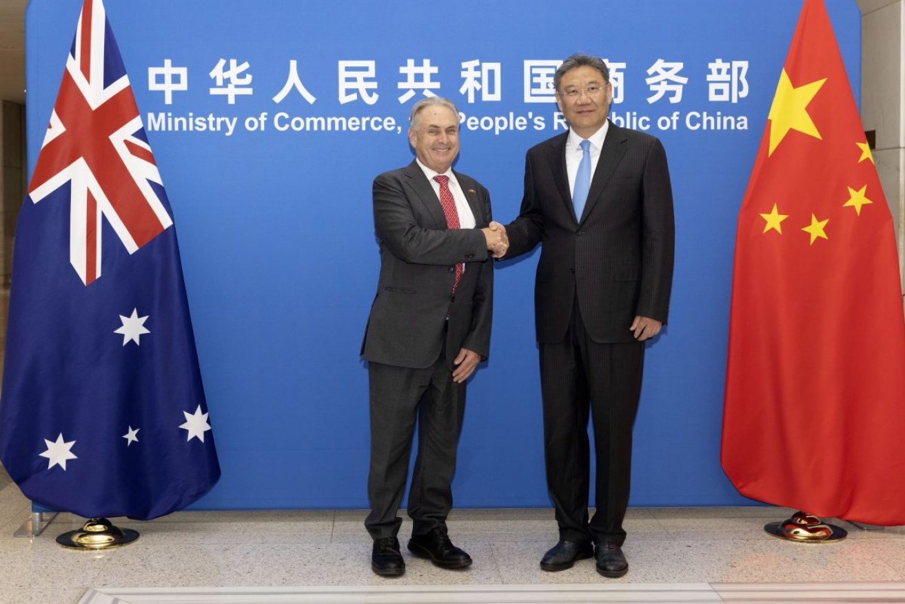 Trade Minister Don Farrell with Chinese Minister of Commerce Wang Wentao in Beijing. Photo: Michael Godfrey/DFAT via AP