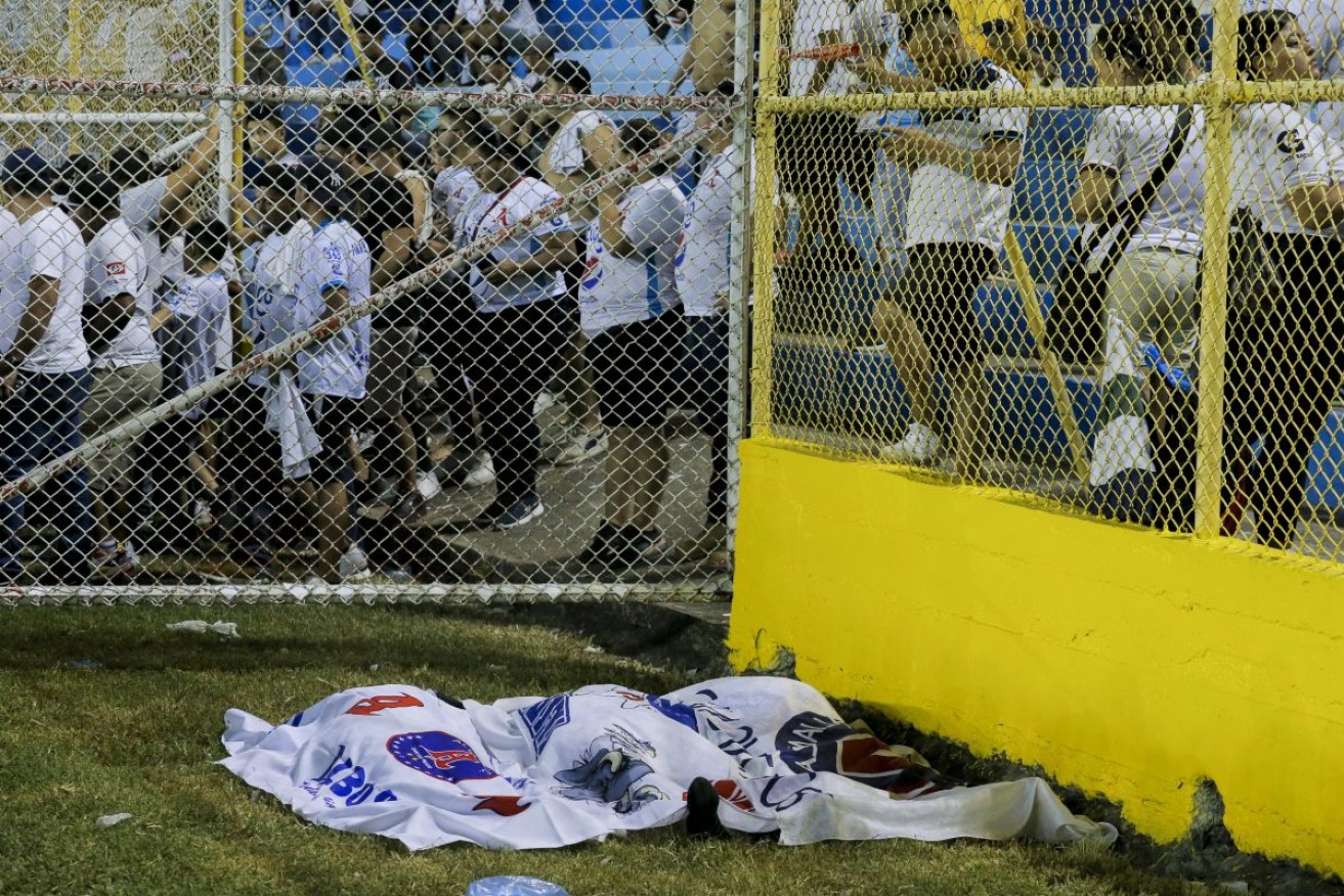 Bodies at Cuscatlan stadium in San Salvador. Photo: AP Photo/Milton Flores