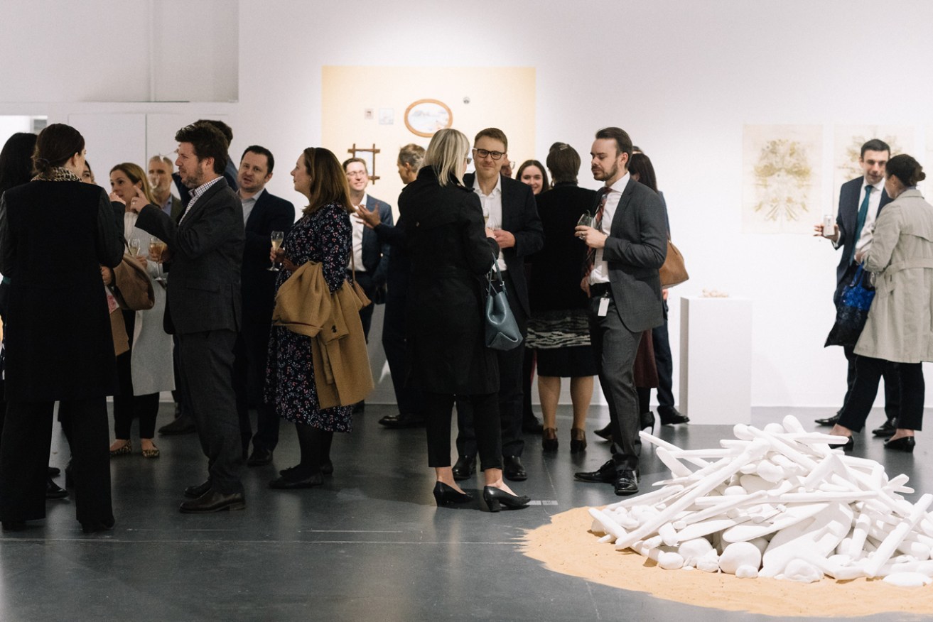Guests mingle at the HA>NESS launch at Adelaide Contemporary Experimental. Photo: Jack Fenby / supplied