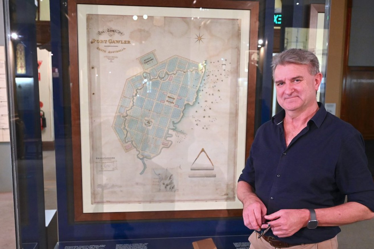 State Library of South Australia senior conservator Peter Zajicek has meticulously restored the map of an SA town never built. Photo: Belinda Willis