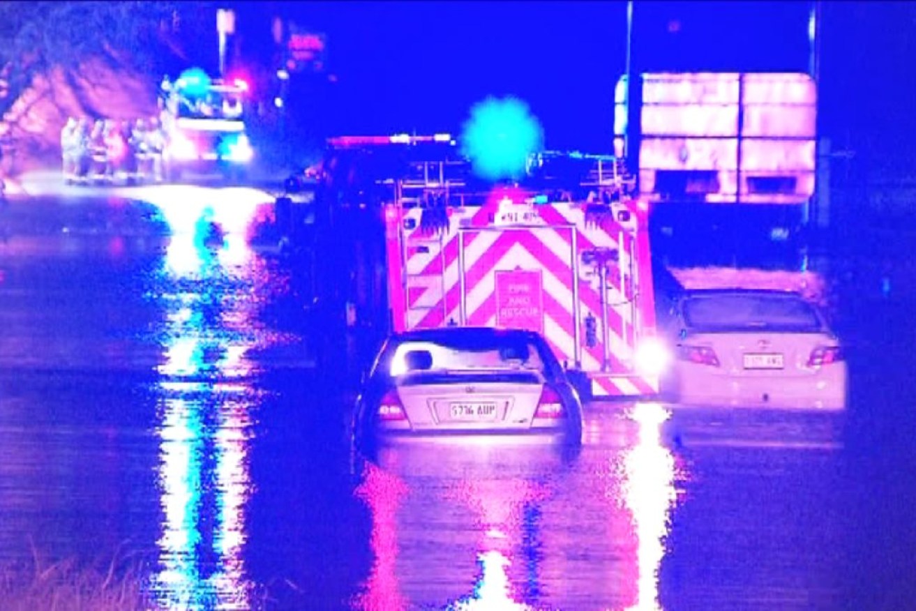 Emergency services retrieve drivers from cars amid flooding at Verdun overnight. Photo: Ten News First/Adelaide Overnight News