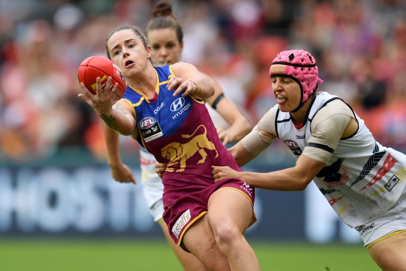 Heather Anderson (right) tackles Jessica Wuetschner during the AFLW Grand Final between the Adelaide Crows and Brisbane Lions in 2017. Photo: AAP/Dan Peled