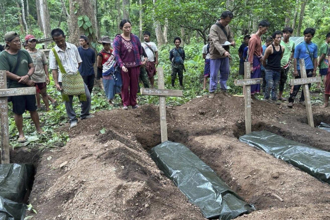 Villagers and resistance fighters bury victims of a military government airstrike near Pasuang in Myanmar's eastern state of Kayah on June 25. Fighting has been fierce in the region, where members of an army-established ethnic Karenni militia recently defected en masse to the resistance side. Photo: Free Burma Rangers via AP