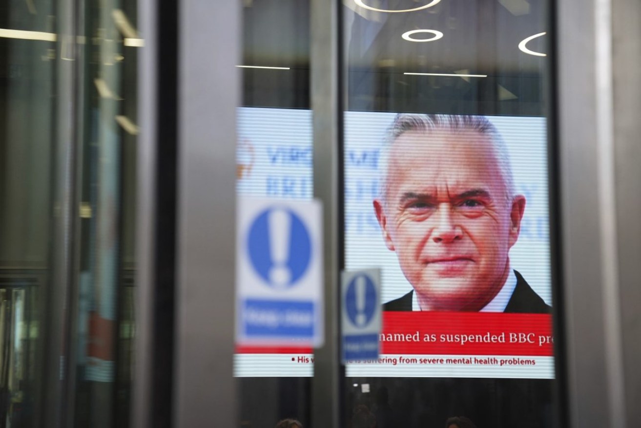 A screen in BBC Broadcasting house shows a story on presenter Huw Edwards. Photo: James Manning/PA via AP