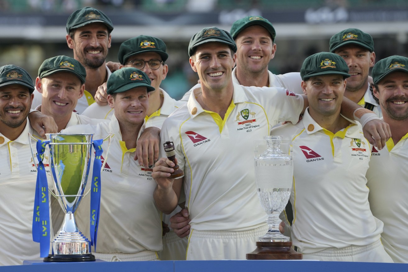 Australia captain Pat Cummins holds the Ashes Urn as Australia retain the trophy on day five of the fifth Ashes Test match between England and Australia. Photo: AP/Kirsty Wigglesworth