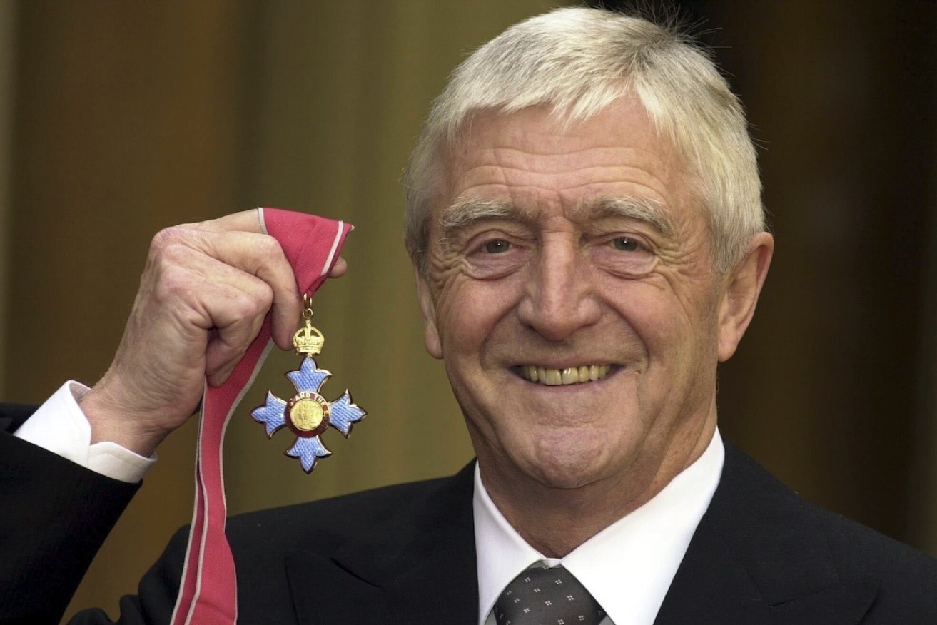 Michael Parkinson after being awarded a CBE in 2000. Photo: Kirsty Wigglesworth/AP