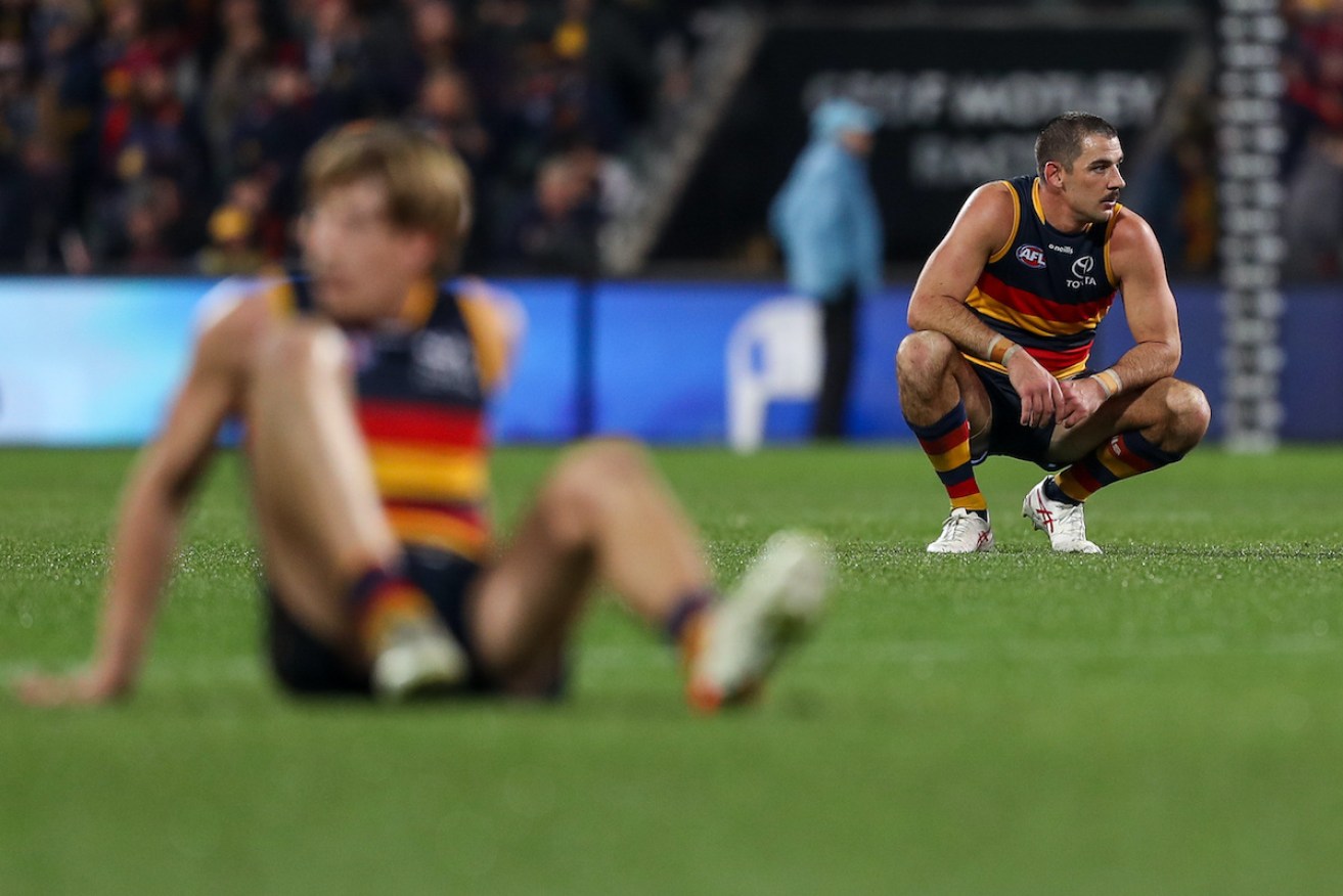 Adelaide missed out on the finals after a goal was judged a point and not reviewed. Photo: AAP/Matt Turner