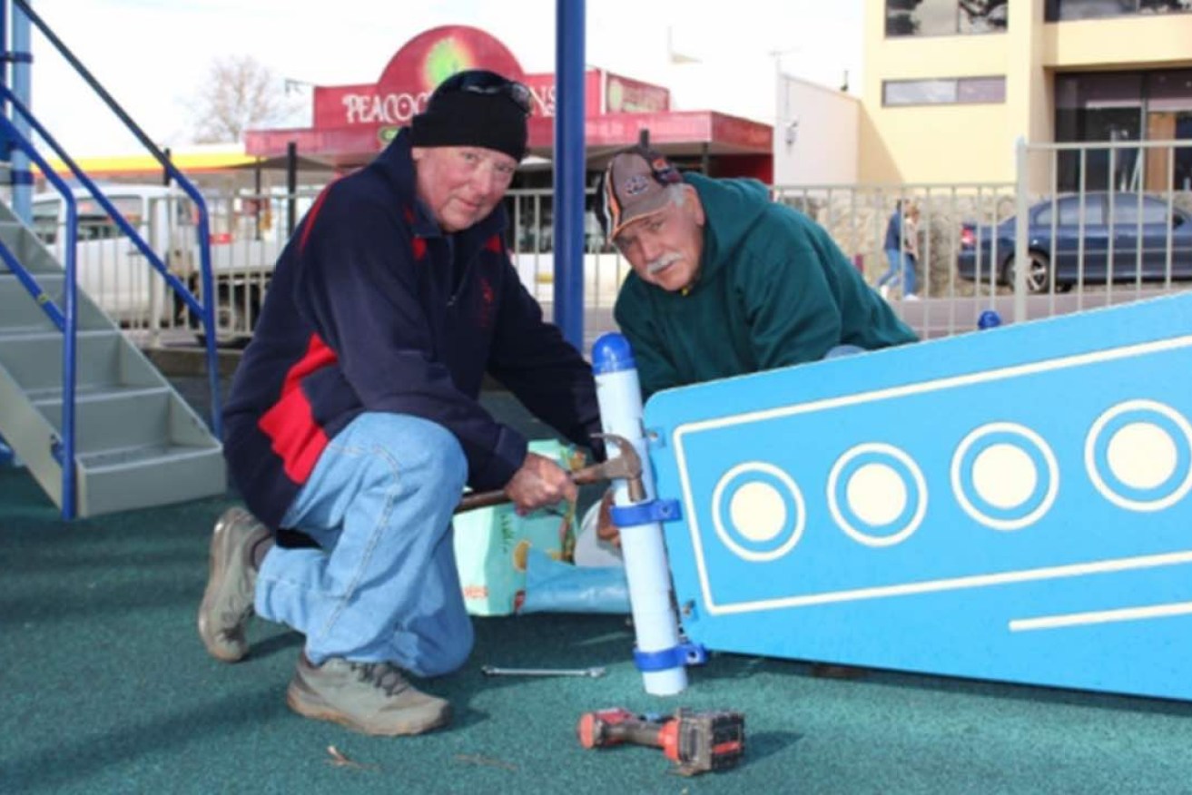 Local Rotarians Tony Stockham and Glenn Karutz dissembling the ‘Tuna Boat’ at the Andrew Small Playground. Photo: City of Port Lincoln.