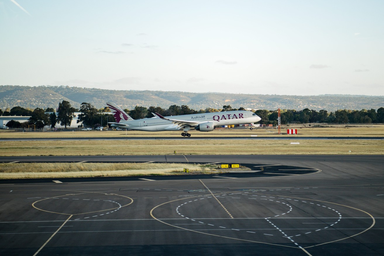 A Qatar Airways flight arriving at Adelaide Ariport. Photo: Morgan Sette/AAP