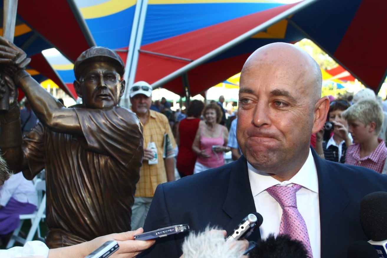 Darren Lehmann speaks to the media at the unveiling of a bronze statue to celebrate his cricket career at Adelaide Oval in 2012. Photo: AAP/Ben McMahon