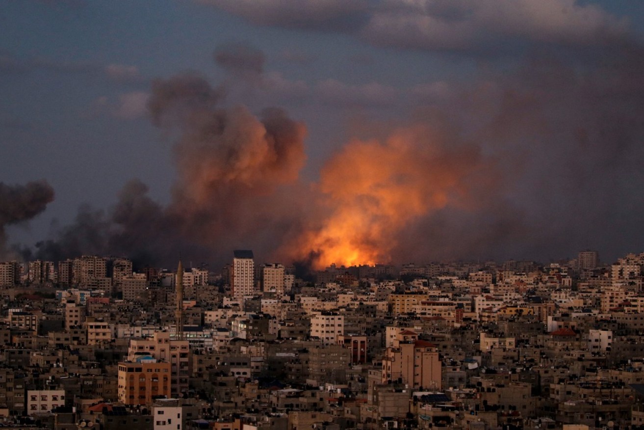 Smoke rises following an Israeli air strike in northern Gaza City, 12 October 2023. Photo: Mohammed Saber/AAP.