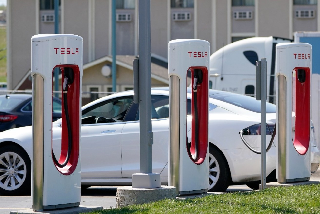 A row of Tesla chargers at a station in Topeka, Kansas. Photo: Orlin Wagner/AP