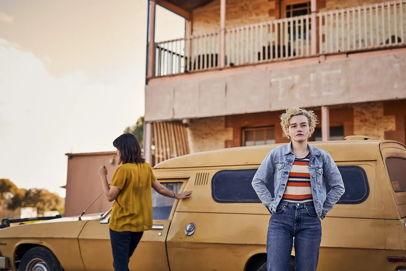 Jessica Henwick and Julia Garner play backpackers Liv and Hanna in the outback thriller 'The Royal Hotel', set in a rundown pub at Yatina. Photo: See-Saw Films