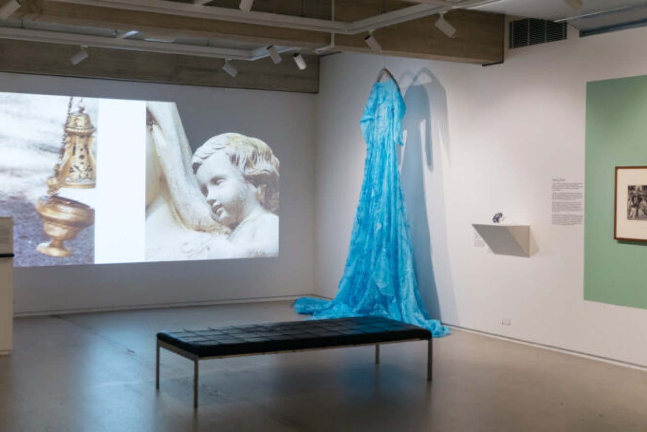 Installation view: The Guildhouse Collections Project: After the Fall, featuring Kate O’Boyle, There’s something about Mary, Mother wound, 2022, digital video, colour, sound, image; PPE COVID gowns, cotton thread, 450.0 x 900.0 cm. Photo: Sia Duff 