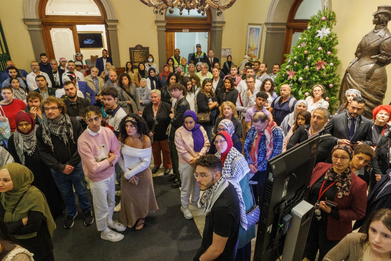 Palestinian advocates in the Town Hall foyer prior to a council debate on whether to light flag in Palestinian colours. Photo: Tony Lewis/InDaily