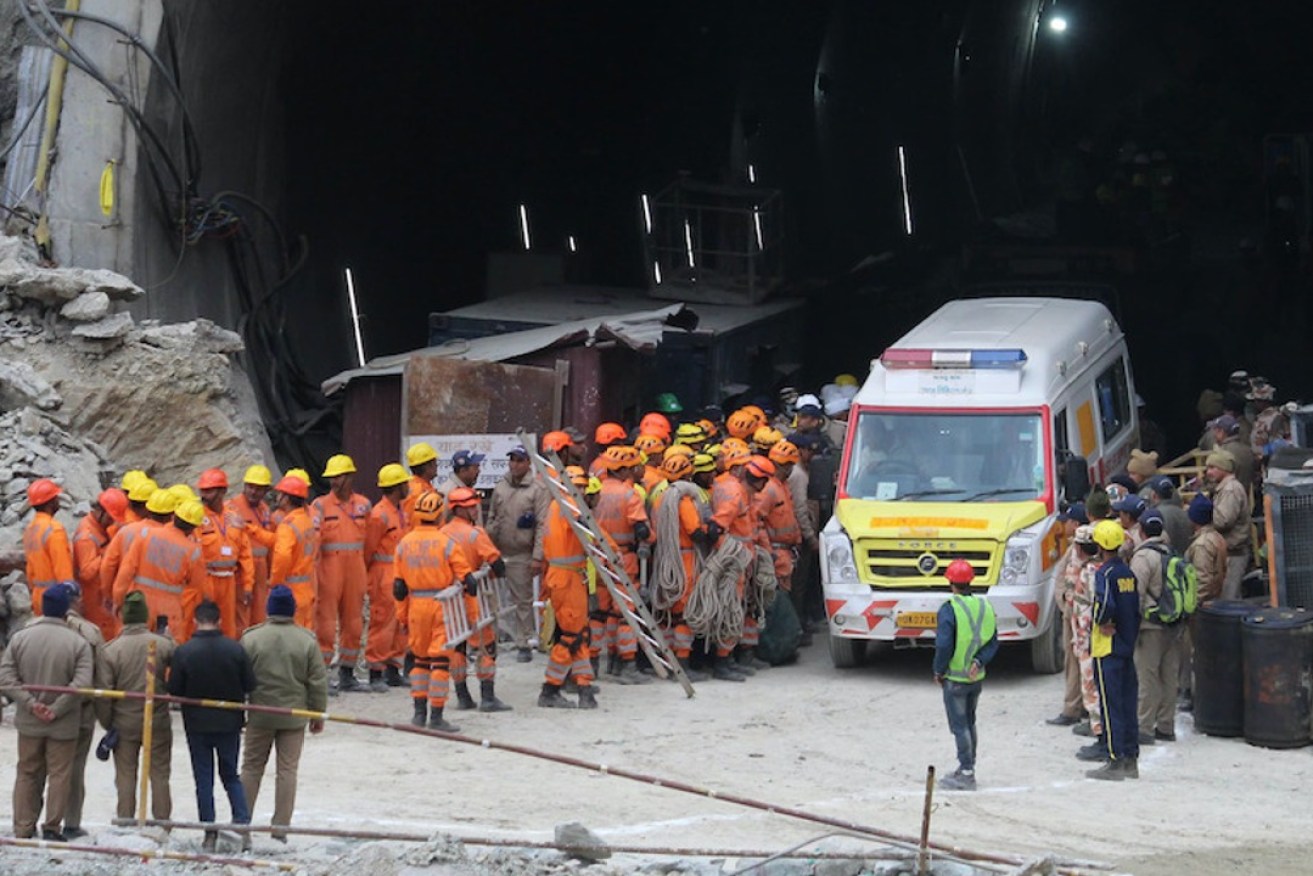 An ambulance waits for the first workers freed from inside the tunnel. Photo: AP
