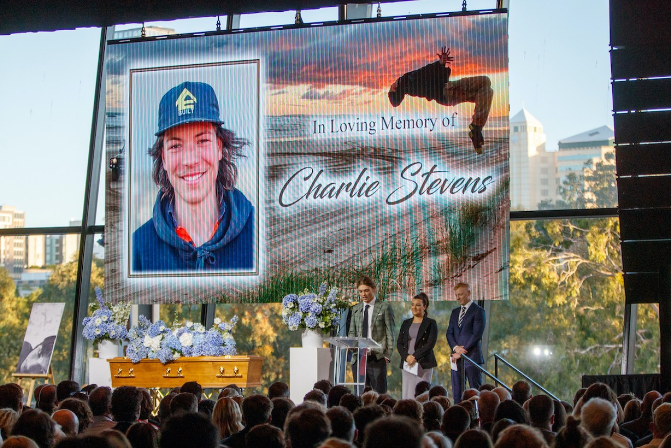 Charlie Stevens' brothers and sister speak during a twilight service at Adelaide Oval. Photo: Matt Turner/AAP