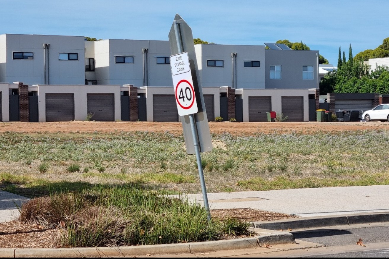 A speed limit sign signalling the end of a school zone in Blakeview. Transport investment in the Adelaide's northern suburbs is set to go under the microscope. Photo: Thomas Kelsall/InDaily