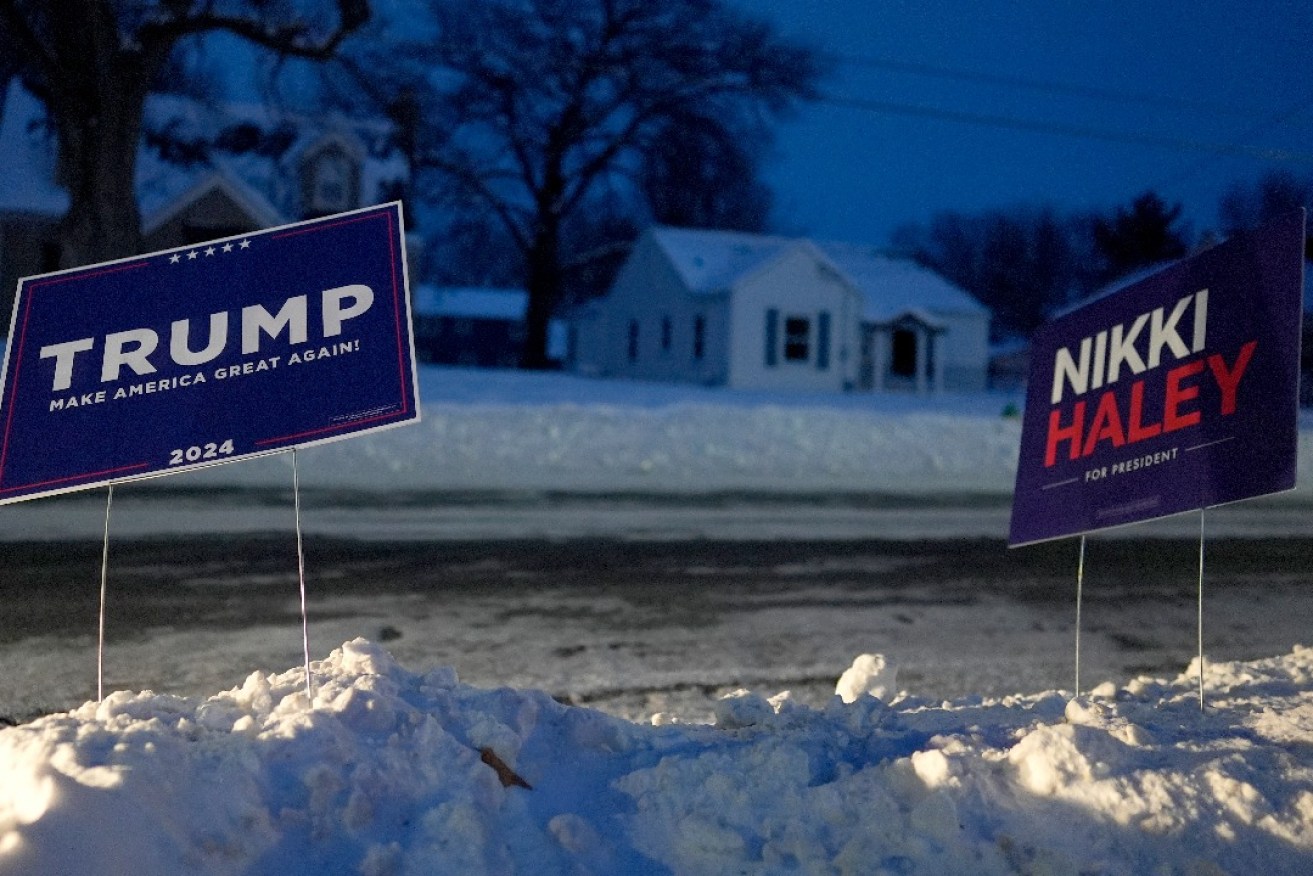 Campaign signs for Republican candidates Donald Trump and Nikki Haley appear outside Franklin Junior High in Des Moines, Iowa, Monday, Jan. 15, 2024. Photo: Carolyn Kaster/AP