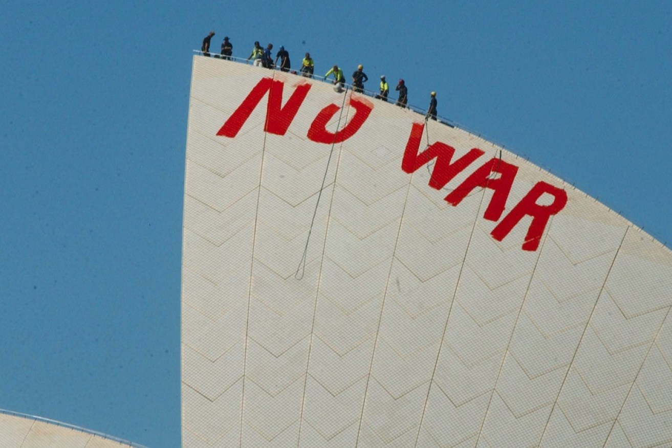 A protest against the Iraq War painted onto the Sydney Opera House in 2006. Photo: AAP/Mick Tsikas