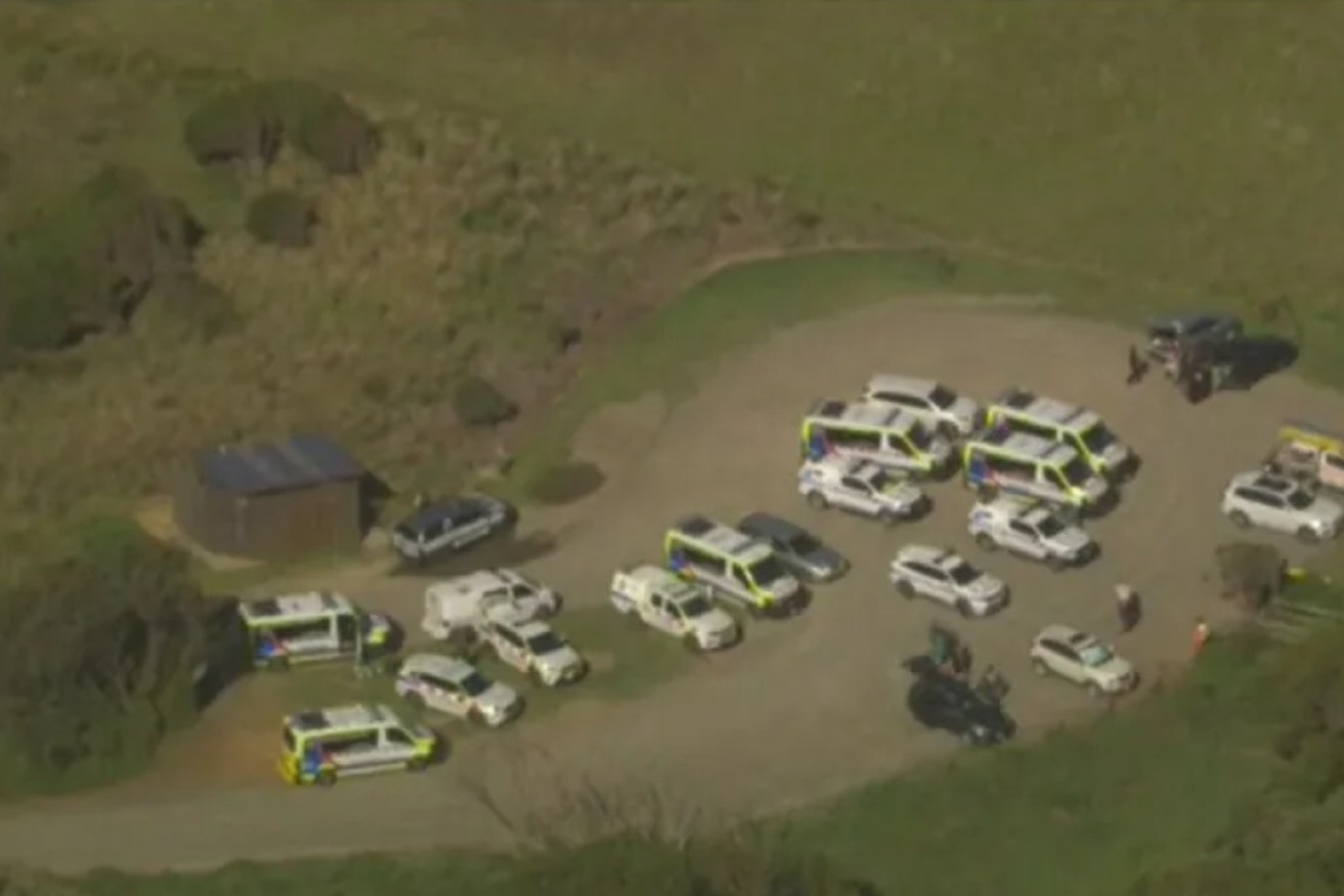 First responders in the carpark near Forrest Caves beach. Photo: 9NEWS screenshot