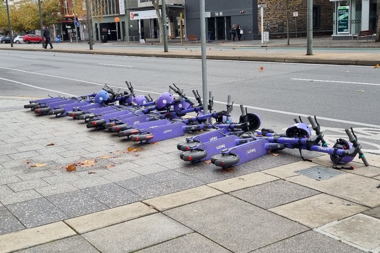 Adelaide's Lord Mayor says e-scooters fallen or dumped on city footpaths are hazardous litter which should be sent to the dump. Photo: Thomas Kelsall/InDaily