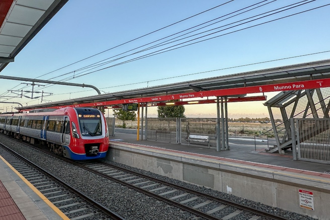 A train arriving at the Munno Para railway station - a site which is surrounded by vacant land. Photo: Tony Lewis/InDaily
