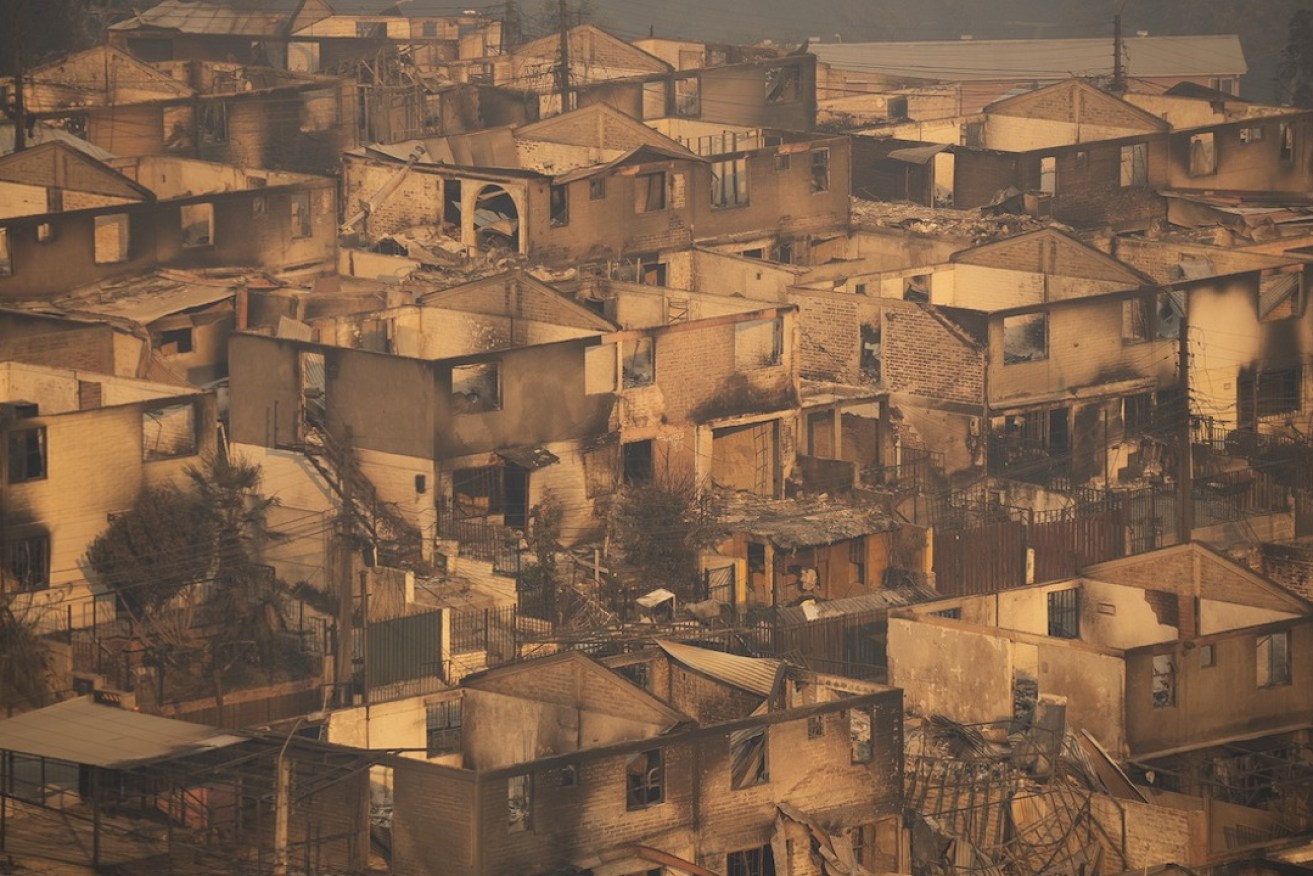 Burned out homes in Chile's Valparaiso region. Photo: Adriana Thomasa/EPA