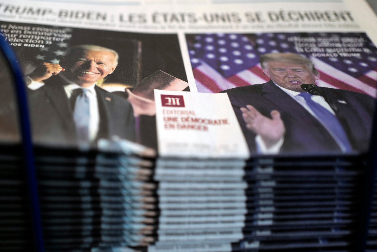 A stack of the French newspaper Le Monde on a newsstand in Paris. Photo: Francois Mori/AP
