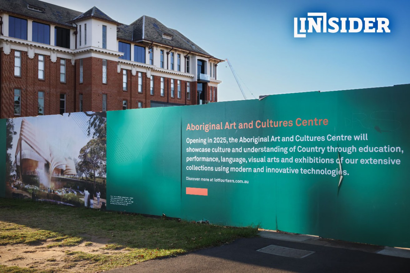 This banner says an Aboriginal cultural centre will open next year despite being put on hold in 2022. Photo: Tony Lewis/InDaily