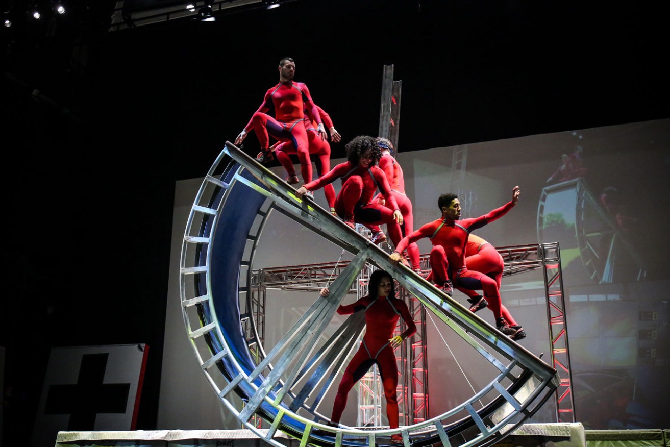 STREB EXTREME ACTION performers – AKA 'action heroes' – moving around one of the bespoke metal machines used in 'Time Machine'. Photo: Ralph Alswang / supplied