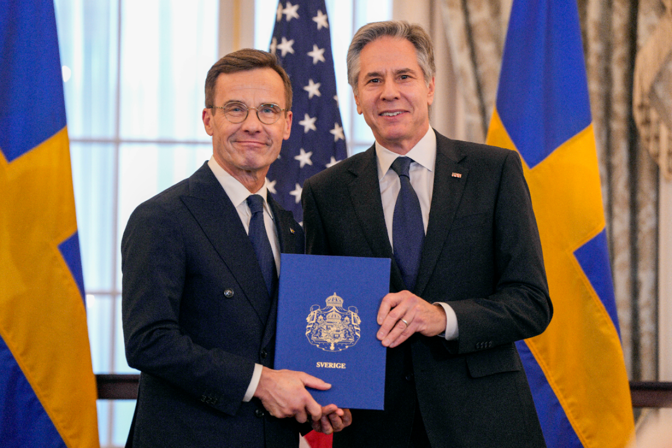 Swedish Prime Minister Ulf Kristersson with US Secretary of State Antony Blinken and Sweden's NATO Instruments of Accession at the State Department. Photo: AP 