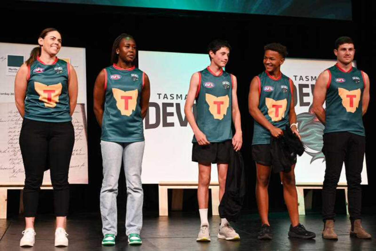 The new Tasmania Devils guernsey is revealed during from the launch of the Tasmania Devils into the AFL, at Theatre Royale in Hobart, Monday, March 18, 2024. Photo: AAP Image/Loic De Guilly