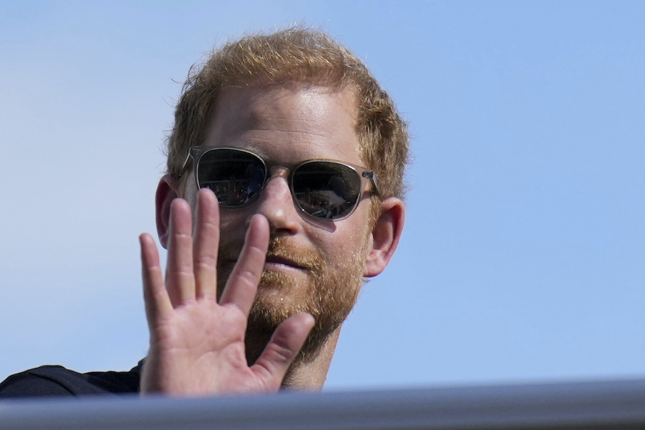 Prince Harry says Murdoch tabloids bugged his landline and accessed pager messages of his mother Princess Diana. Photo AAP