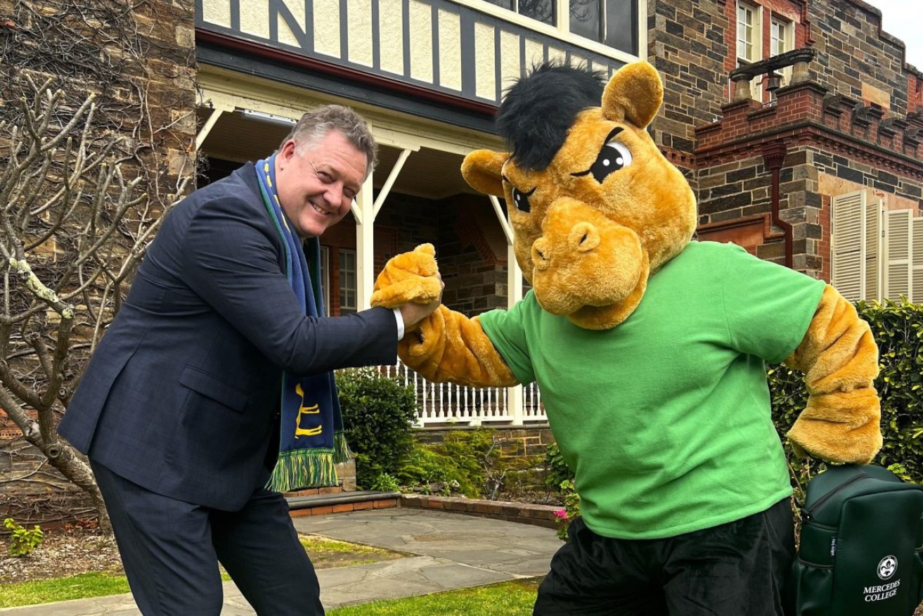 Mercedes College principal Andrew Balkwill and the school's mascot. Photo: supplied