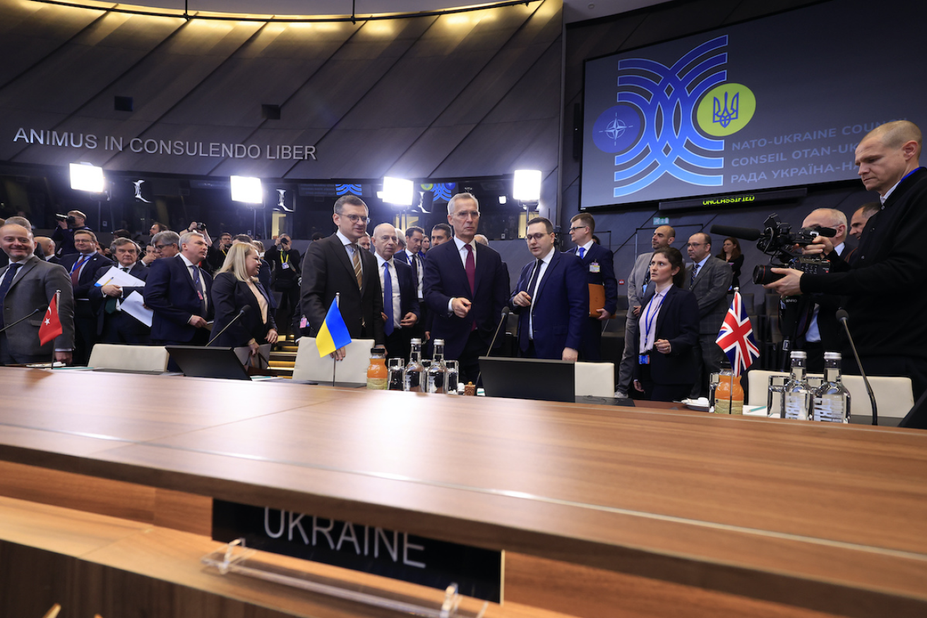 NATO Secretary General Jens Stoltenberg, center, speaks with Ukraine's Foreign Minister Dmytro Kuleba, center left, during a meeting of the NATO-Ukraine Council at NATO headquarters in Brussels on Thursday. Photo: AP
