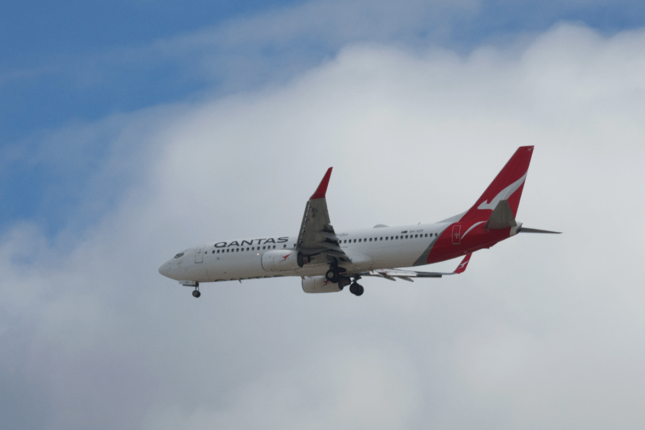 Qantas will pay $225 to domestic customers and $450 to international ones. Photo: Tony Lewis/InDaily