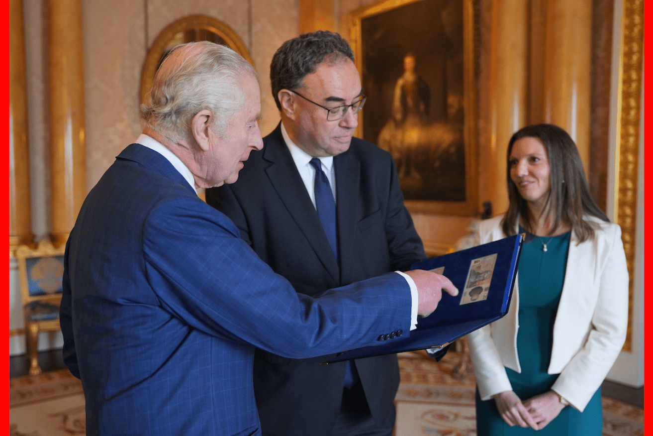 King Charles is presented with the first bank notes featuring his portrait from Bank of England officials at Buckingham Palace. Photo: PA