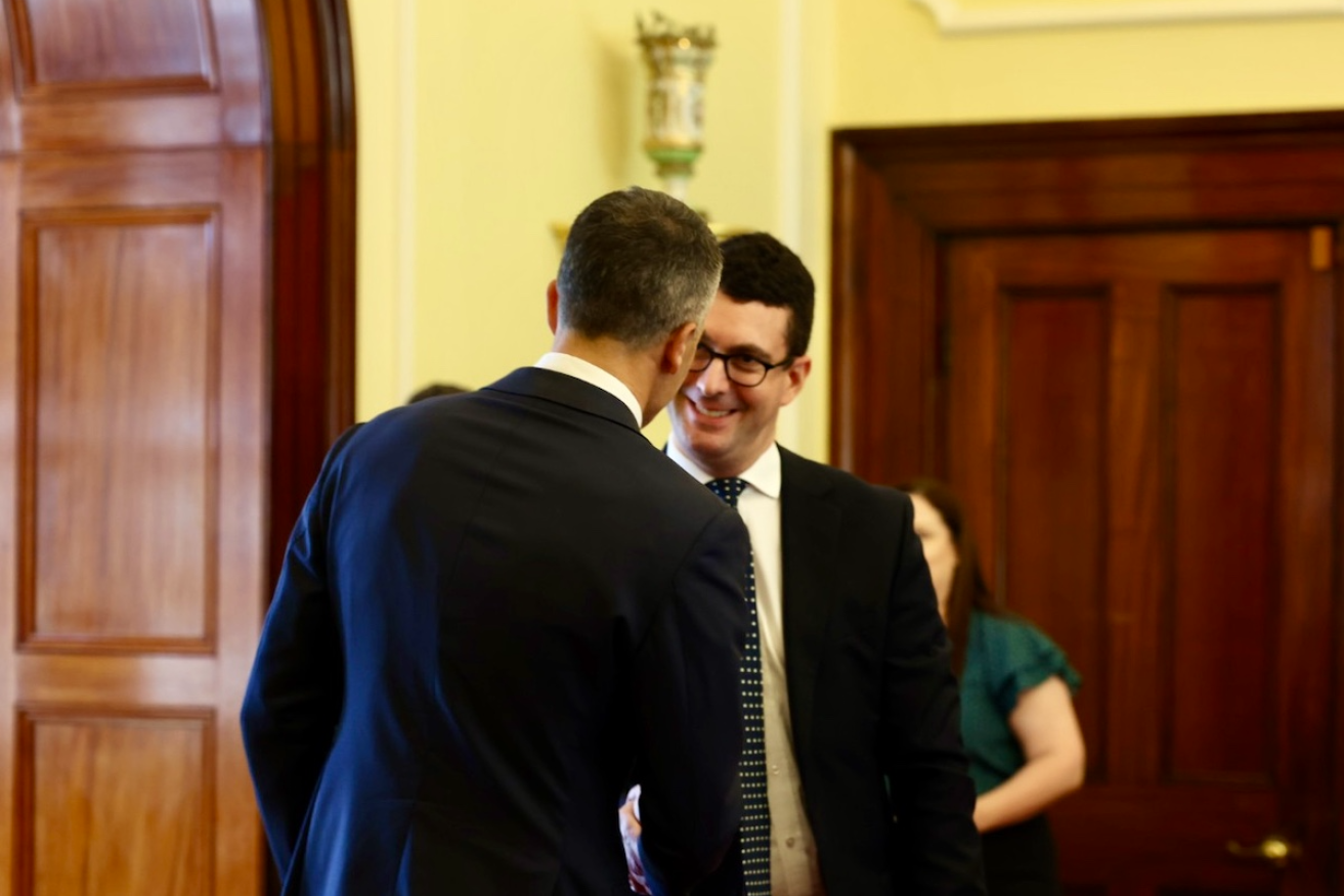 Premier Peter Malinauskas congratulates new minister and former Speaker Dan Cregan at this morning's swearing-in. Photo: Tony Lewis/InDaily